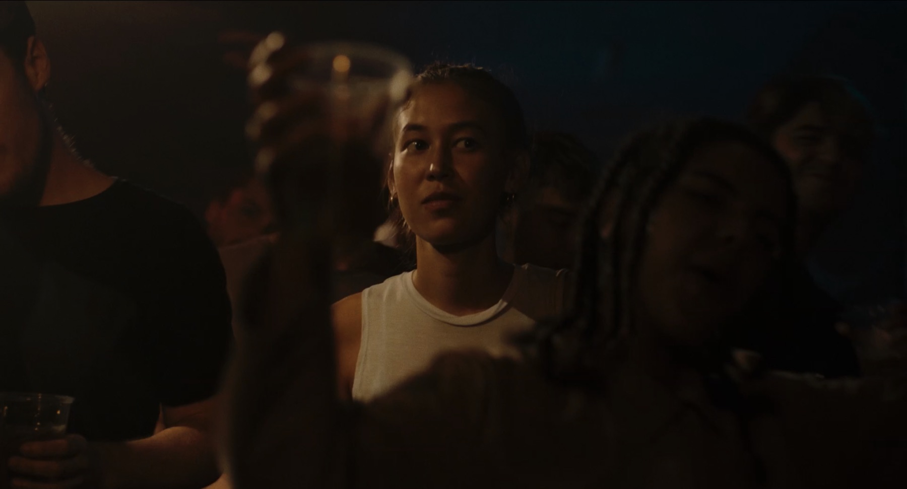 Livia in a crowded club at night